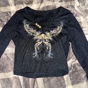Gray, long sleeved women’s crop top with design on front